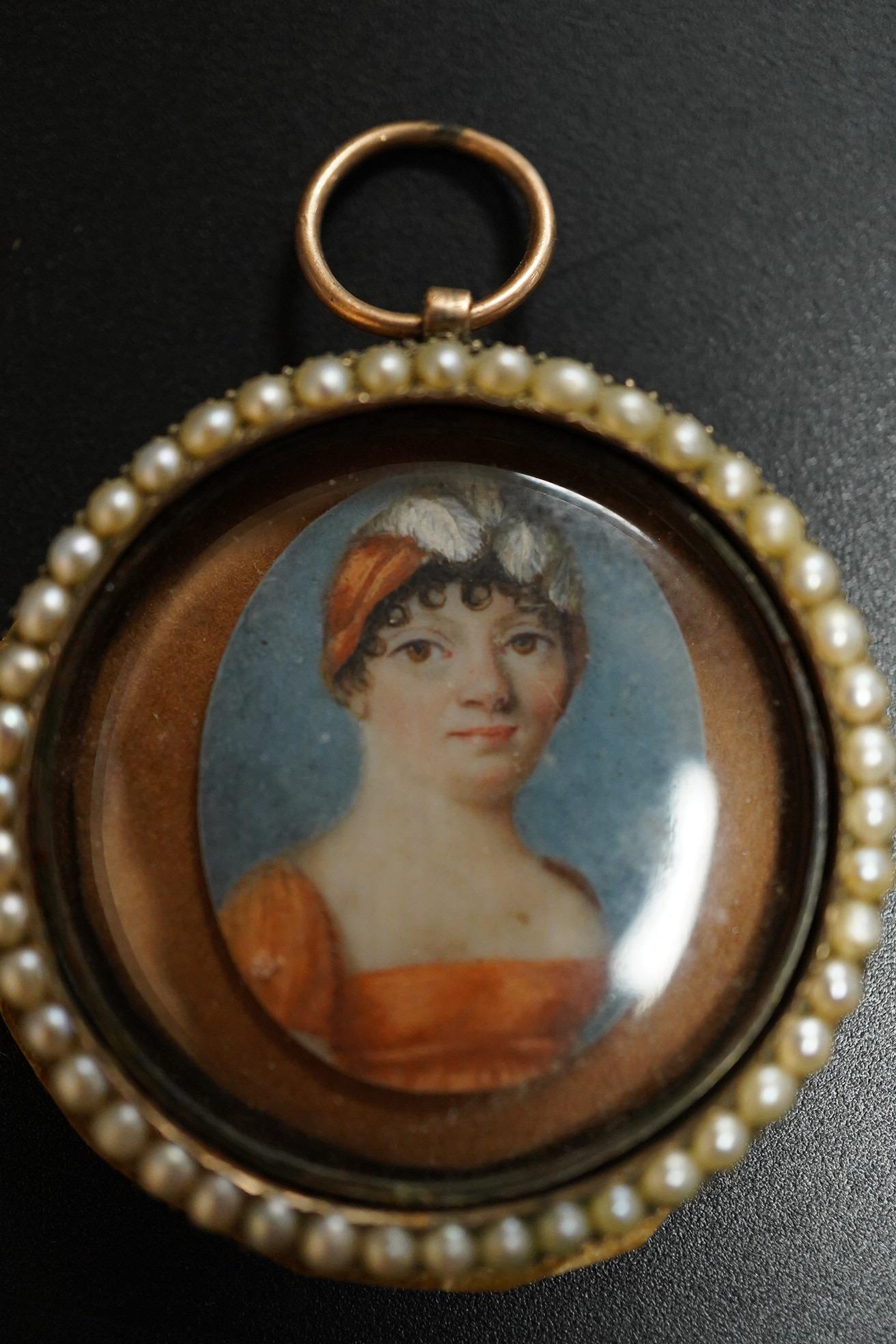 Regency School, Oval portrait miniature of a lady, watercolour on ivory, housed in a split pearl and yellow metal frame (untested) inscribed Anne Groves?, obt. 1800, aged 48, 3.5cm in diameter IVORY SUBMISSION L8EYBNUP